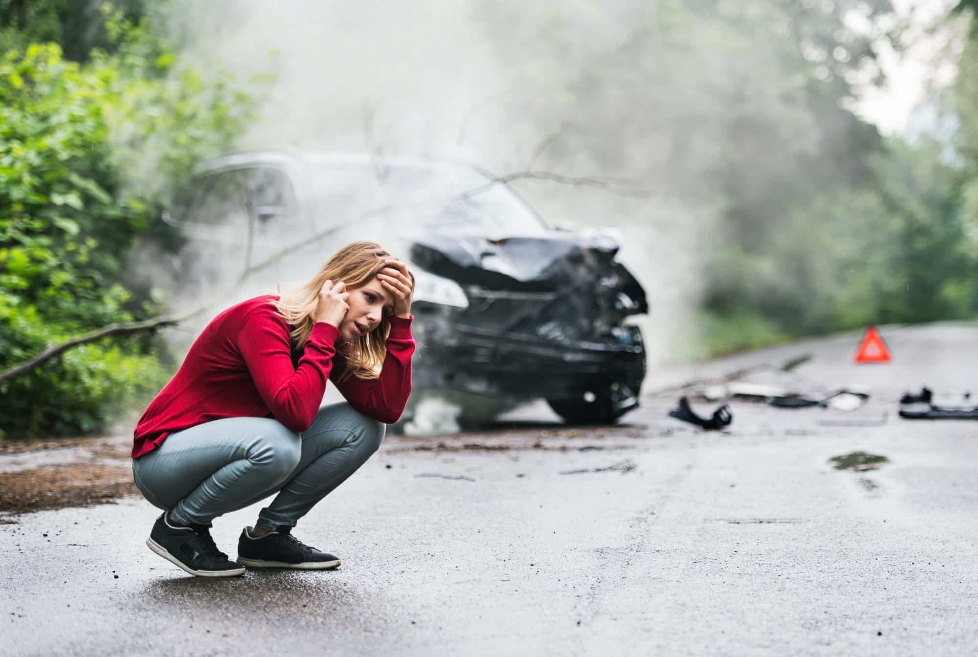 An Orange Beach, AL, woman calling her lawyer after getting into a car accident.